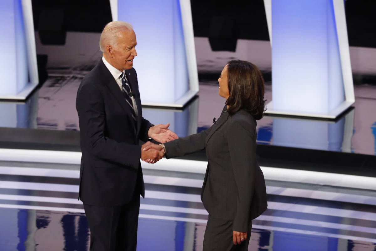 FILE - In this July 31, 2019, file photo, fFormer Vice President Joe Biden shakes hands with Se ...