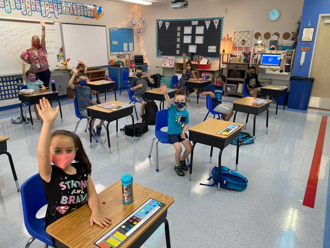 Students participate in class on the first day of school Wednesday, Aug. 12, 2020 at the Dr. Mi ...