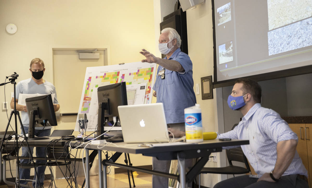 Jeffrey Peters, second from right, speaks during a "Live & On Line" meeting of The Concerned Ci ...