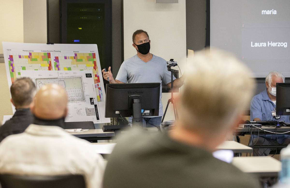 Bob Gronauer, top/left, a partner with Kaempfer Crowell, gives a presentation during a “Live ...