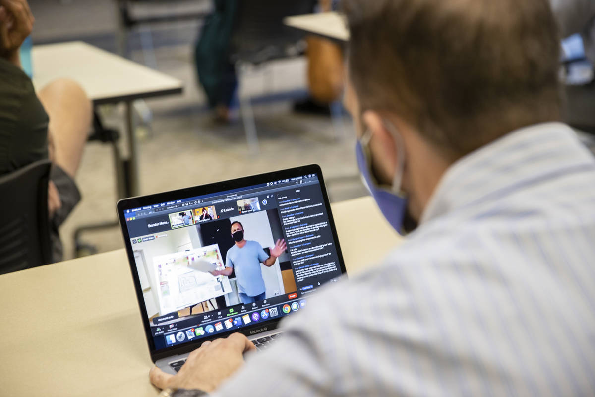 Brandon Monson, bottom/right, watches Bob Gronauer's virtual presentation during a "Live & On L ...