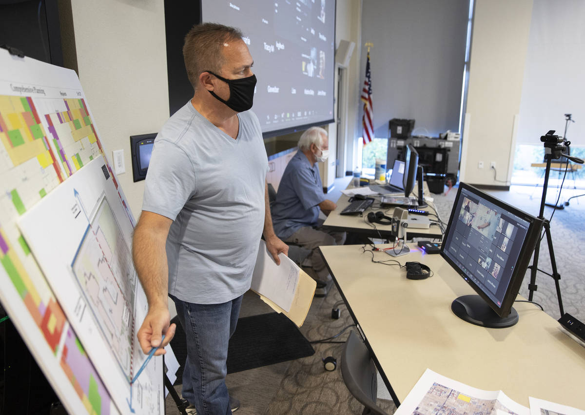 Bob Gronauer, left, a partner with Kaempfer Crowell, gives a presentation during a "Live & On L ...