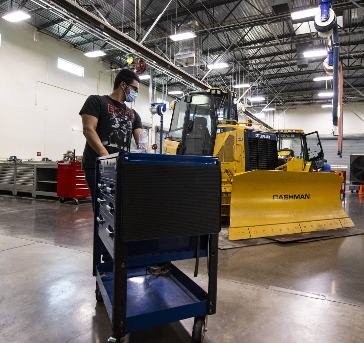 Student Samuel Branch, of Henderson, moves a tool cart during a diesel hydraulics class at the ...