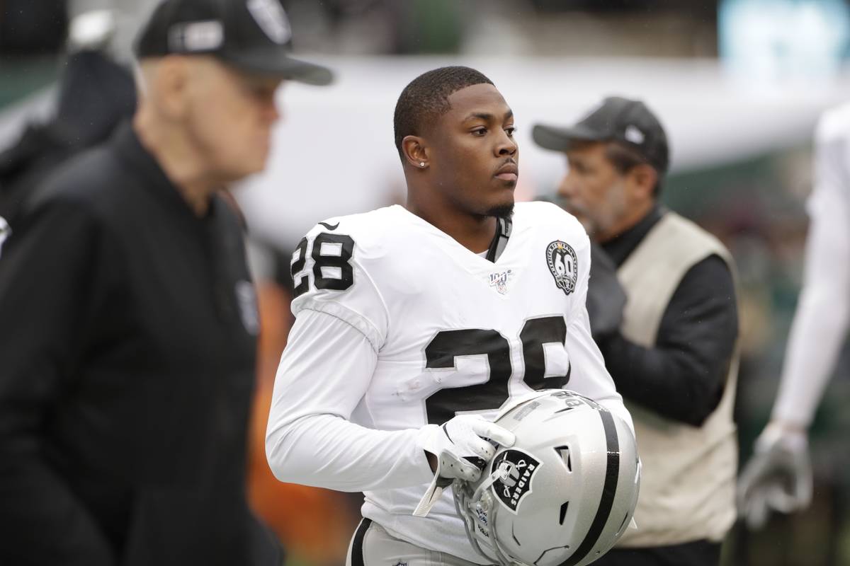 Oakland Raiders running back Josh Jacobs (28) warms up before an NFL football game against the ...