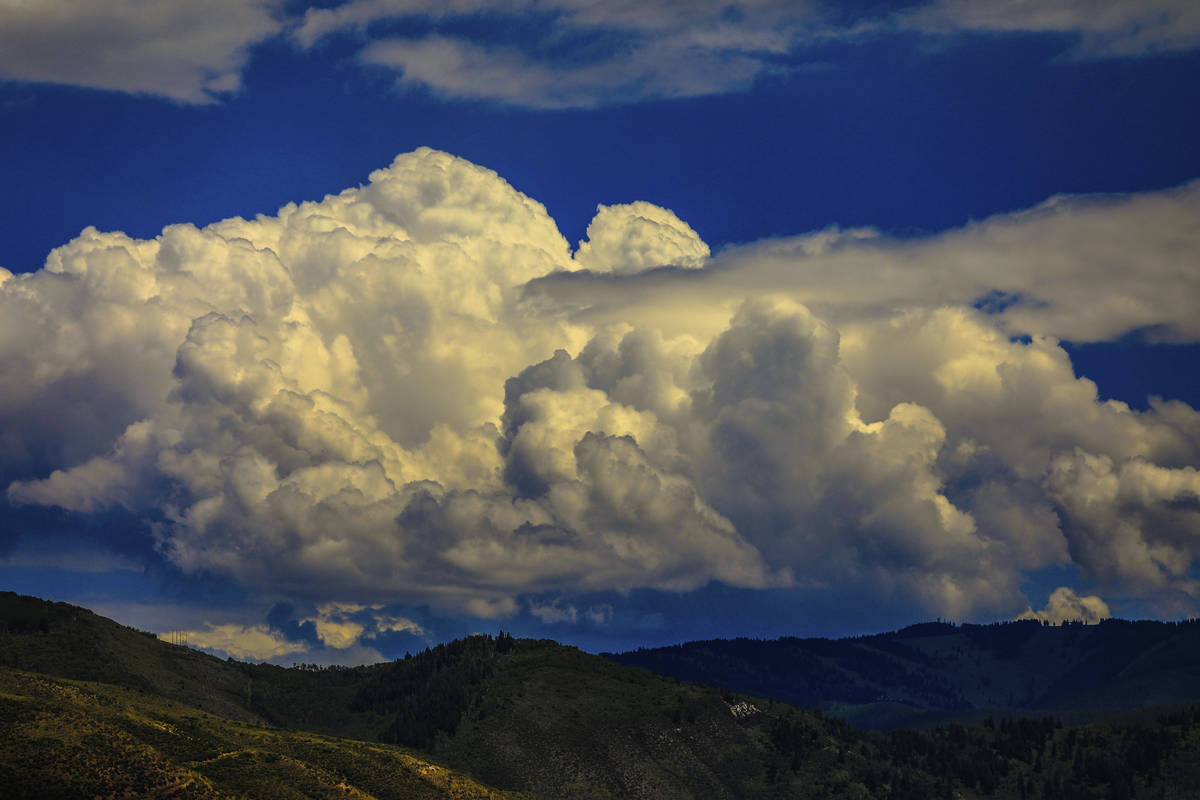 Cumulonimbus clouds build over Vail Mountain, Thursday, July 23, 2020 in Vail, Colo. Afternoon ...