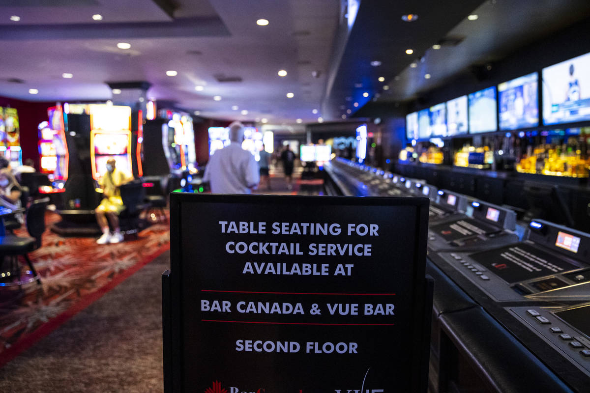 A sign at the Longbar, closed due to state mandates, at the D Las Vegas on Tuesday, Aug. 11, 20 ...