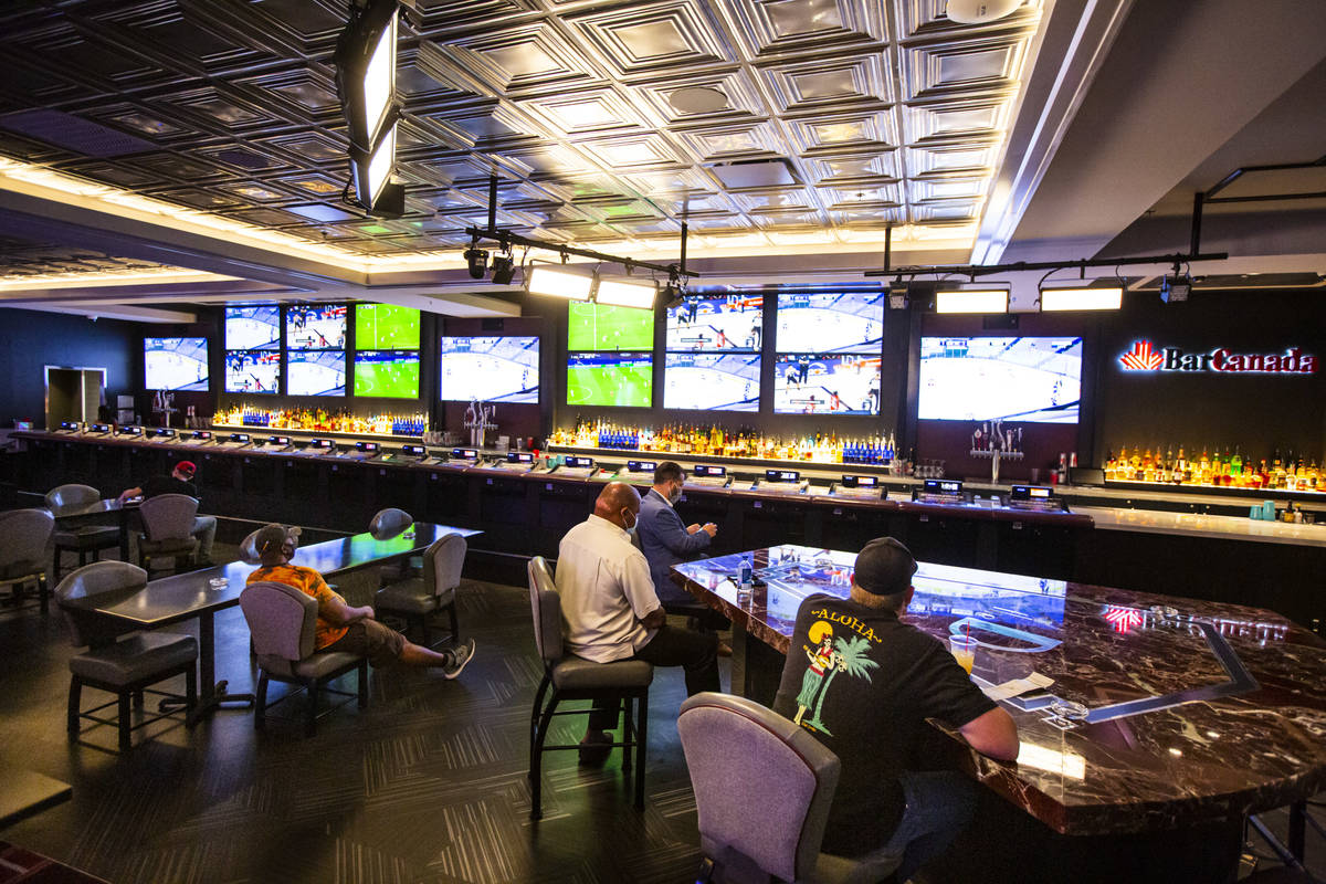People practice social distancing at BarCanada while watching NHL, NBA and european soccer game ...
