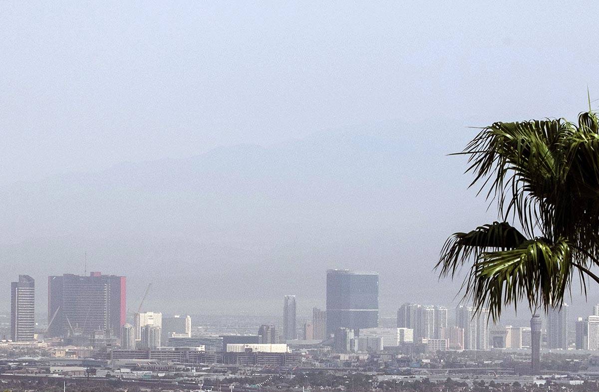 A haze hangs over the Strip as seen from Henderson on Thursday, Aug. 13, 2020, in Las Vegas. Cl ...