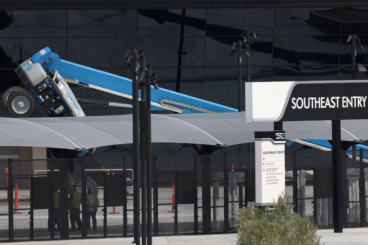 A boom lift lays on its side on the exterior of Allegiant Stadium in Las Vegas, Thursday, Aug. ...