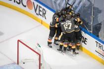 Vegas Golden Knights players celebrate the win over the Chicago Blackhawks after an NHL hockey ...