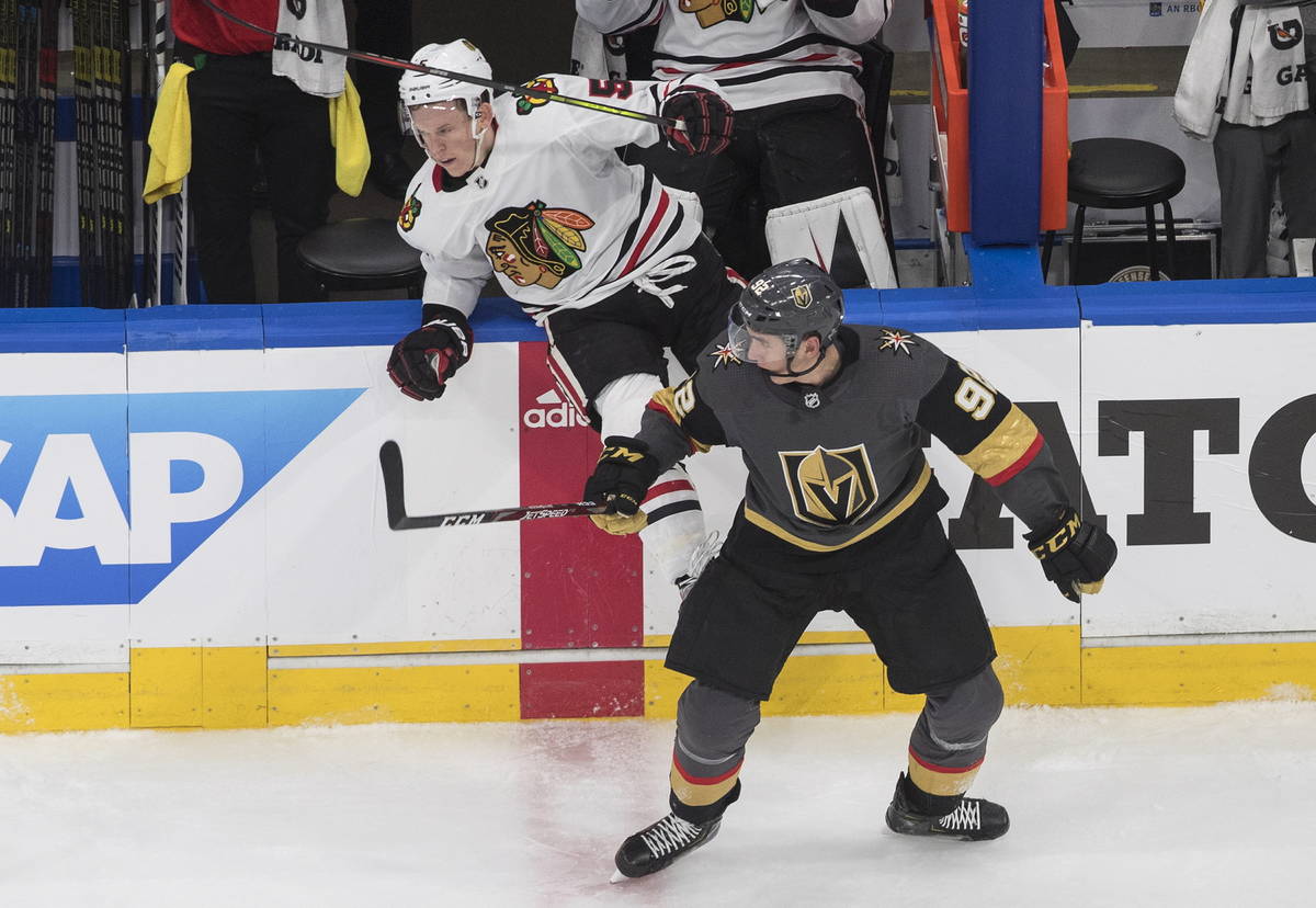 Vegas Golden Knights' Tomas Nosek (92) checks Chicago Blackhawks' Connor Murphy (5) during the ...