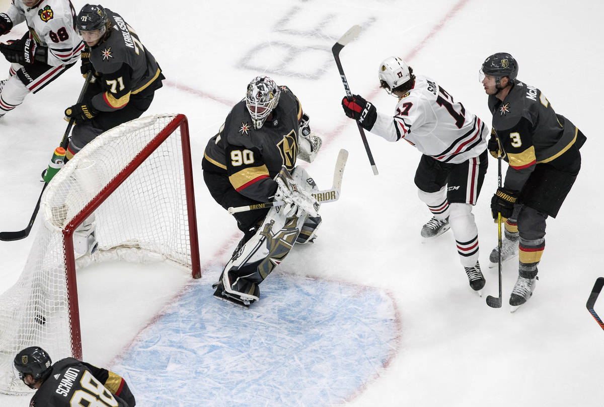 Vegas Golden Knights goalie Robin Lehner (90) is scored on by Chicago Blackhawks' Dylan Strome ...