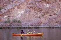 Jonathan Boyles and Dayana Garcia, both of Las Vegas, kayak on the Colorado River in Black Cany ...