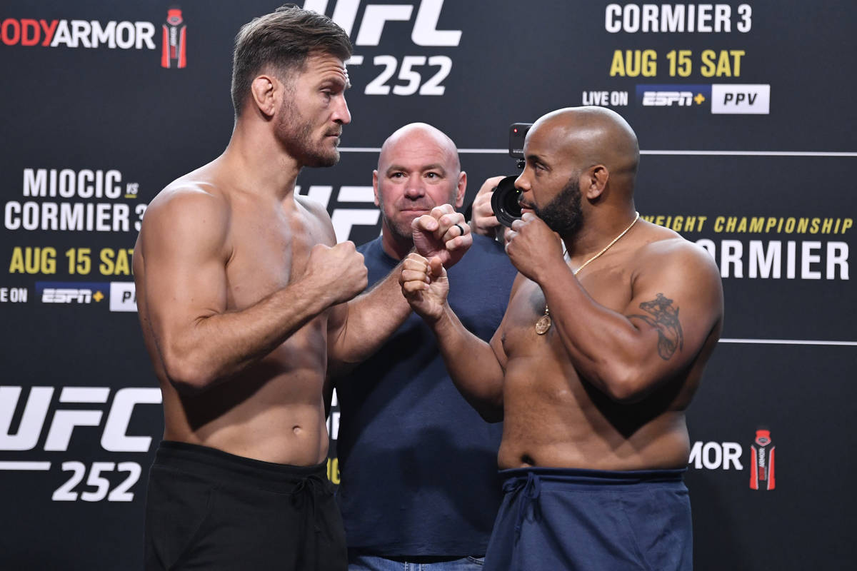Opponents Stipe Miocic (left) and Daniel Cormier face off during the UFC 252 weigh-in at UFC AP ...