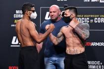 (L-R) Opponents Herbert Burns of Brazil and Daniel Pineda face off during the UFC 252 weigh-in ...