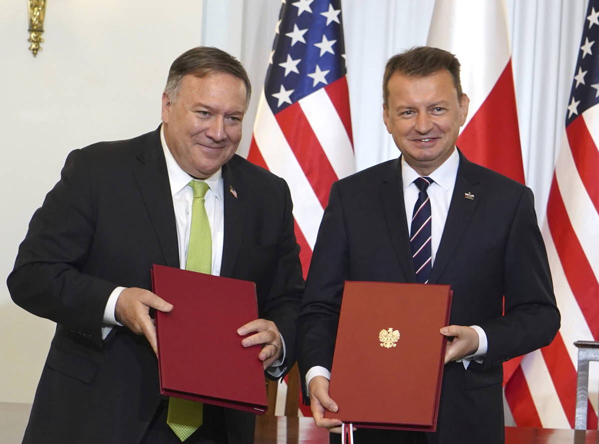 US Secretary of State Mike Pompeo, left, and Poland's Minister of Defence Mariusz Blaszczak pos ...
