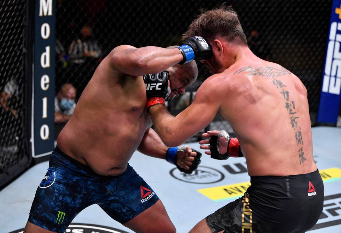 LAS VEGAS, NEVADA - AUGUST 15: (L-R) Daniel Cormier punches Stipe Miocic in their UFC heavyweig ...