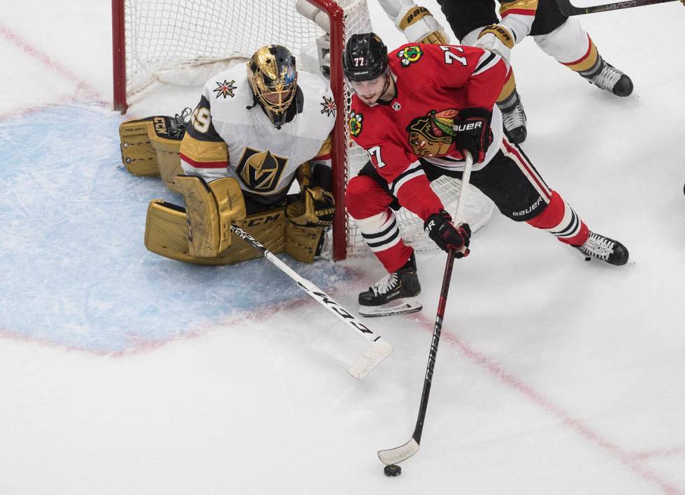 Vegas Golden Knights goalie Marc-Andre Fleury (29) watches as Chicago Blackhawks' Kirby Dach (7 ...