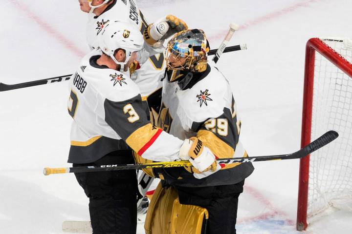 Vegas Golden Knights' Brayden McNabb (3) and goalie Marc-Andre Fleury (29) celebrate the win ov ...