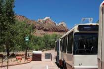 A tourist shuttle bus is seen in Zion National Park, Utah, on Wednesday, July 1, 2020. Now two ...
