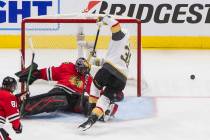 Vegas Golden Knights' Patrick Brown (38) is stopped by Chicago Blackhawks goalie Corey Crawford ...