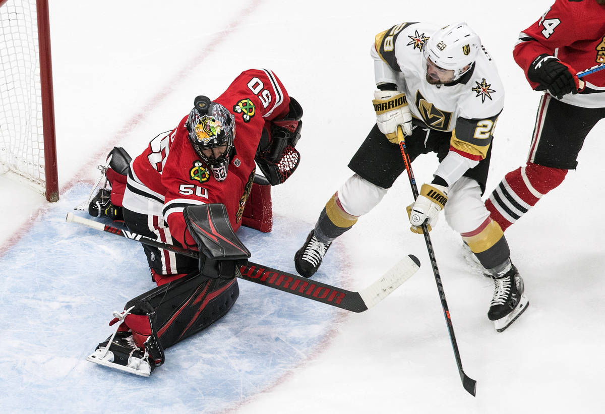 Vegas Golden Knights' William Carrier (28) is stopped by Chicago Blackhawks goalie Corey Crawfo ...