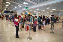 Passengers arriving in Rome from four Mediterranean countries receive instructions by airport s ...