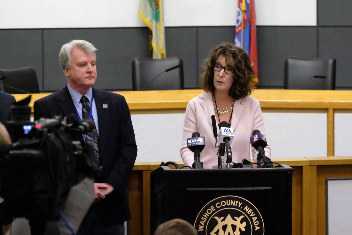 Washoe County schools Superintendent Kristen McNeill, right, speaks to reporters at a briefing ...