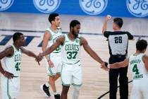 Boston Celtics' Semi Ojeleye (37) is congratulated by teammates Javonte Green and Carsen Edward ...
