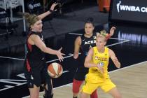 Chicago Sky guard Courtney Vandersloot (22) passes the ball in front of Las Vegas Aces center C ...