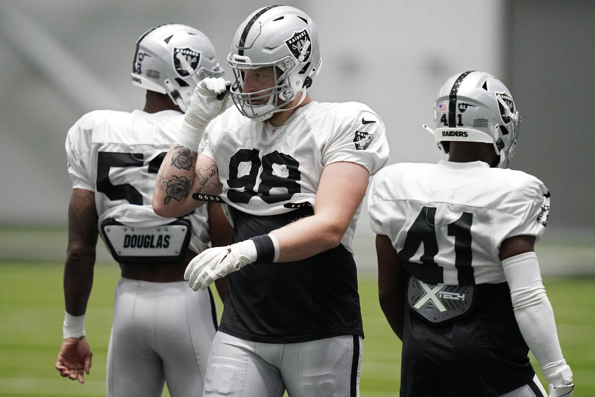 Las Vegas Raiders defensive end Maxx Crosby attends an NFL football training camp practice Mond ...