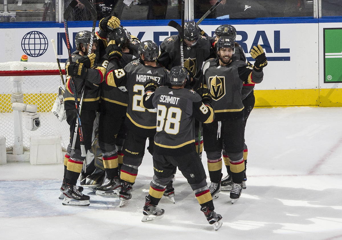 Vegas Golden Knights celebrate after a win over the Chicago Blackhawk in Game 5 of an NHL hocke ...