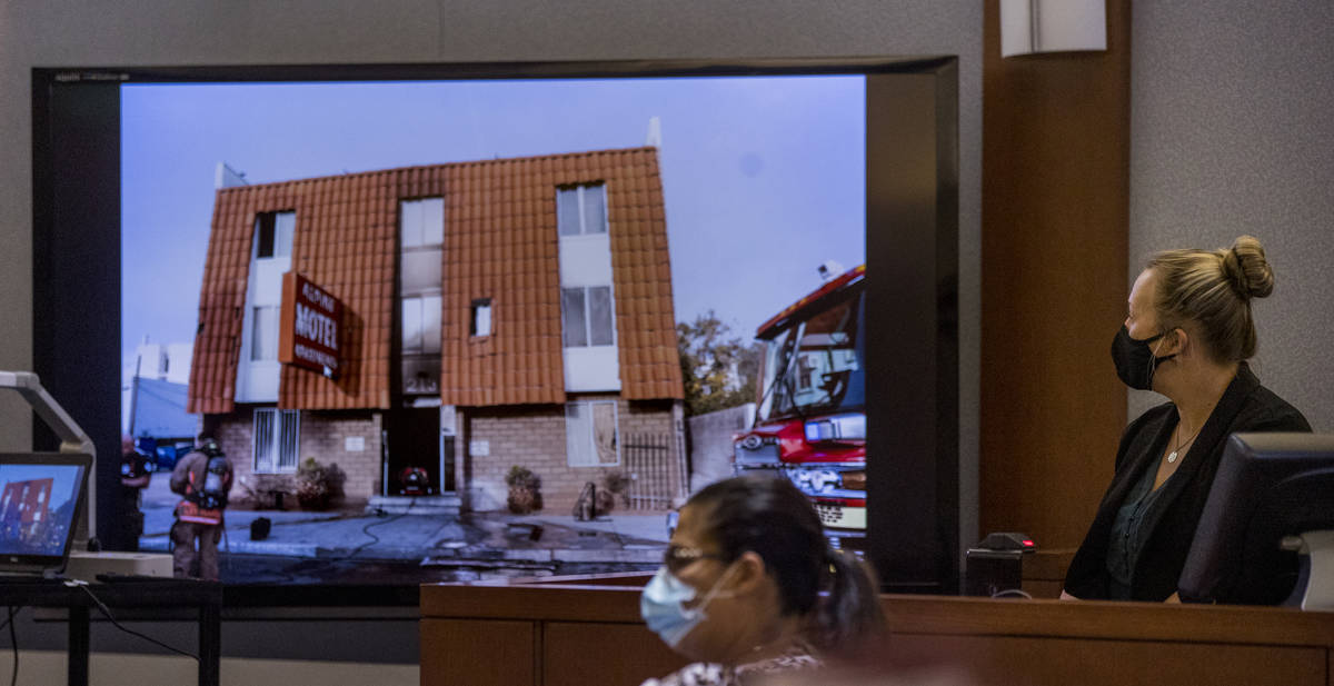 Senior Crime Scene Analyst Noelle Herring with Metro police looks to an exterior image while an ...