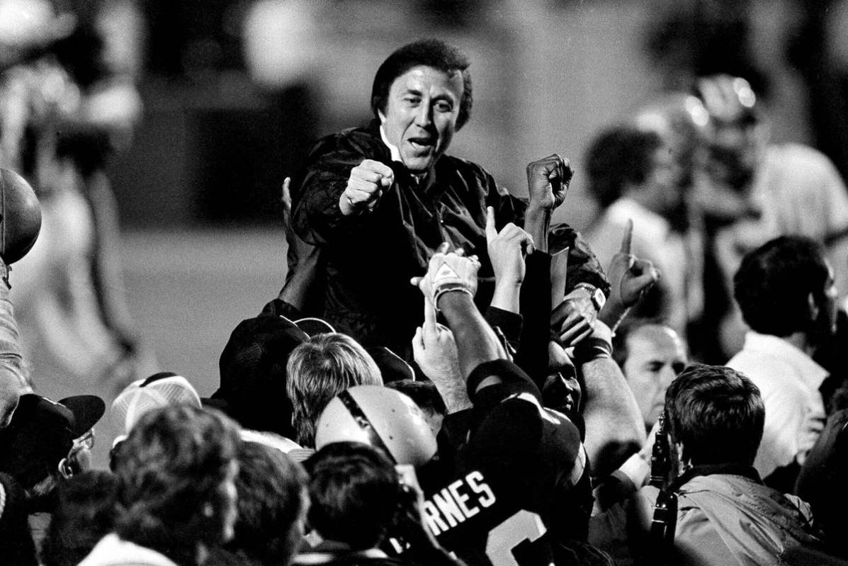 In this Jan. 23, 1984, file photo, coach Tom Flores gestures to members of the Los Angeles Raid ...