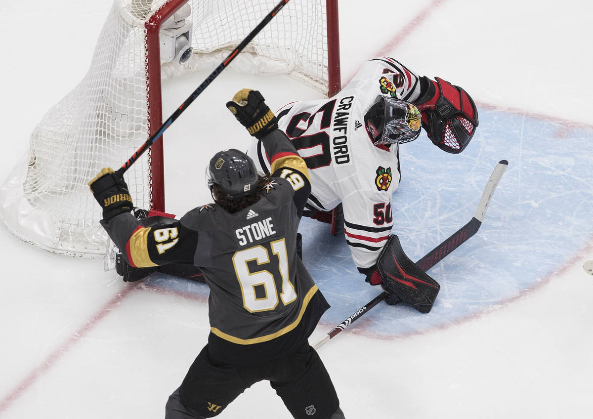 Vegas Golden Knights' Mark Stone (61) celebrates a goal on Chicago Blackhawks goalie Corey Craw ...