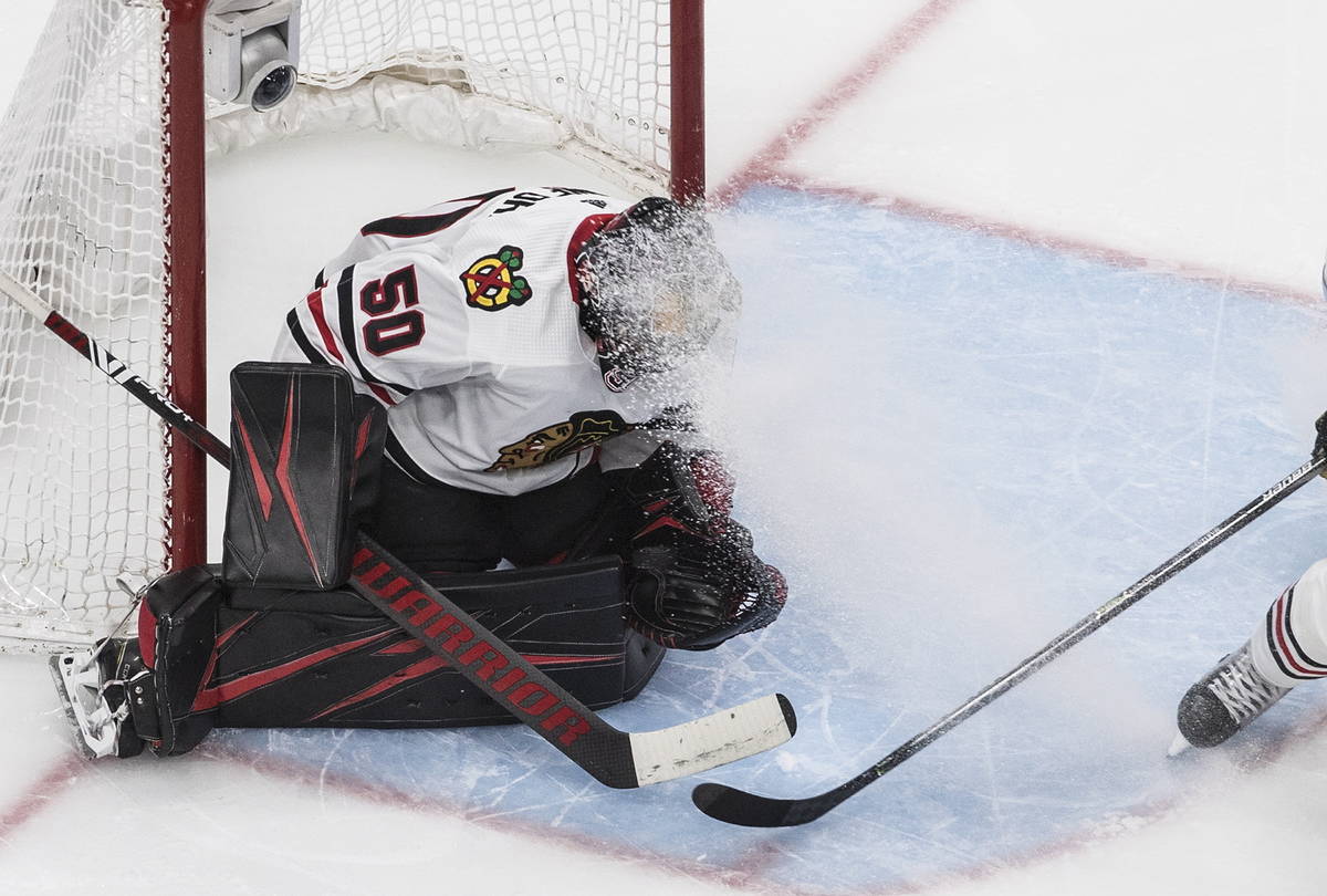 Chicago Blackhawks goalie Corey Crawford is sprayed with ice shavings during the second period ...