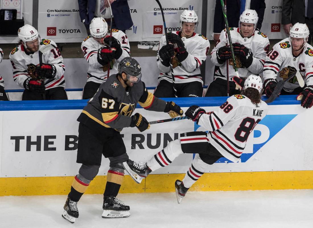 Vegas Golden Knights' Max Pacioretty (67) checks Chicago Blackhawks' Patrick Kane (88) during t ...