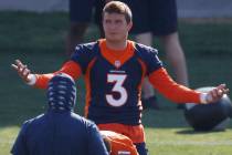 Denver Broncos quarterback Drew Lock (3) takes part in drills during an NFL football practice a ...