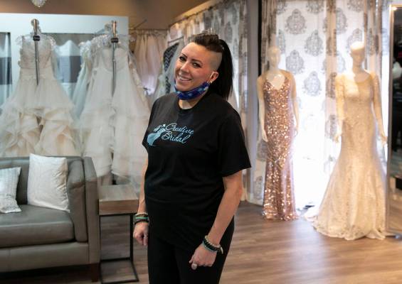 Veronica Markowsky, co- owner of Creative Bridal Wear, poses for a photo at her store on Friday ...