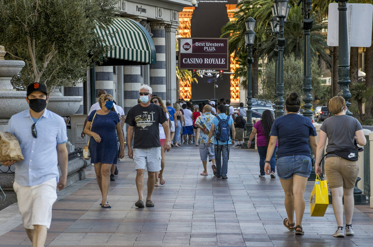 Visitors wander about the Casino Royale along the Las Vegas Strip, Aug. 7, 2020. (L.E. Baskow/L ...