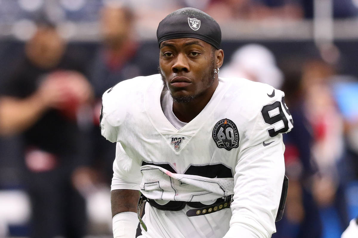 Oakland Raiders defensive end Arden Key (99) stretches before an NFL game against the Houston T ...