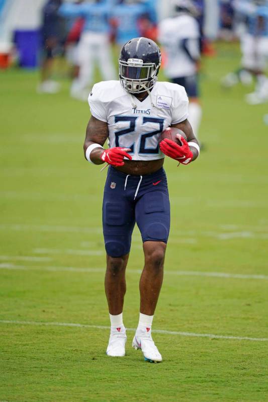 Tennessee Titans running back Derrick Henry runs a drill during NFL football training camp Frid ...