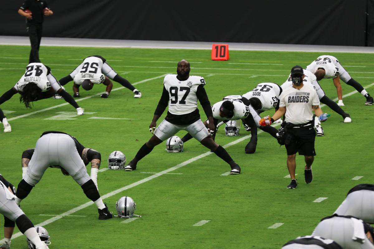 Las Vegas Raiders defensive tackle Maliek Collins (97) stretches before a team practice at Alle ...