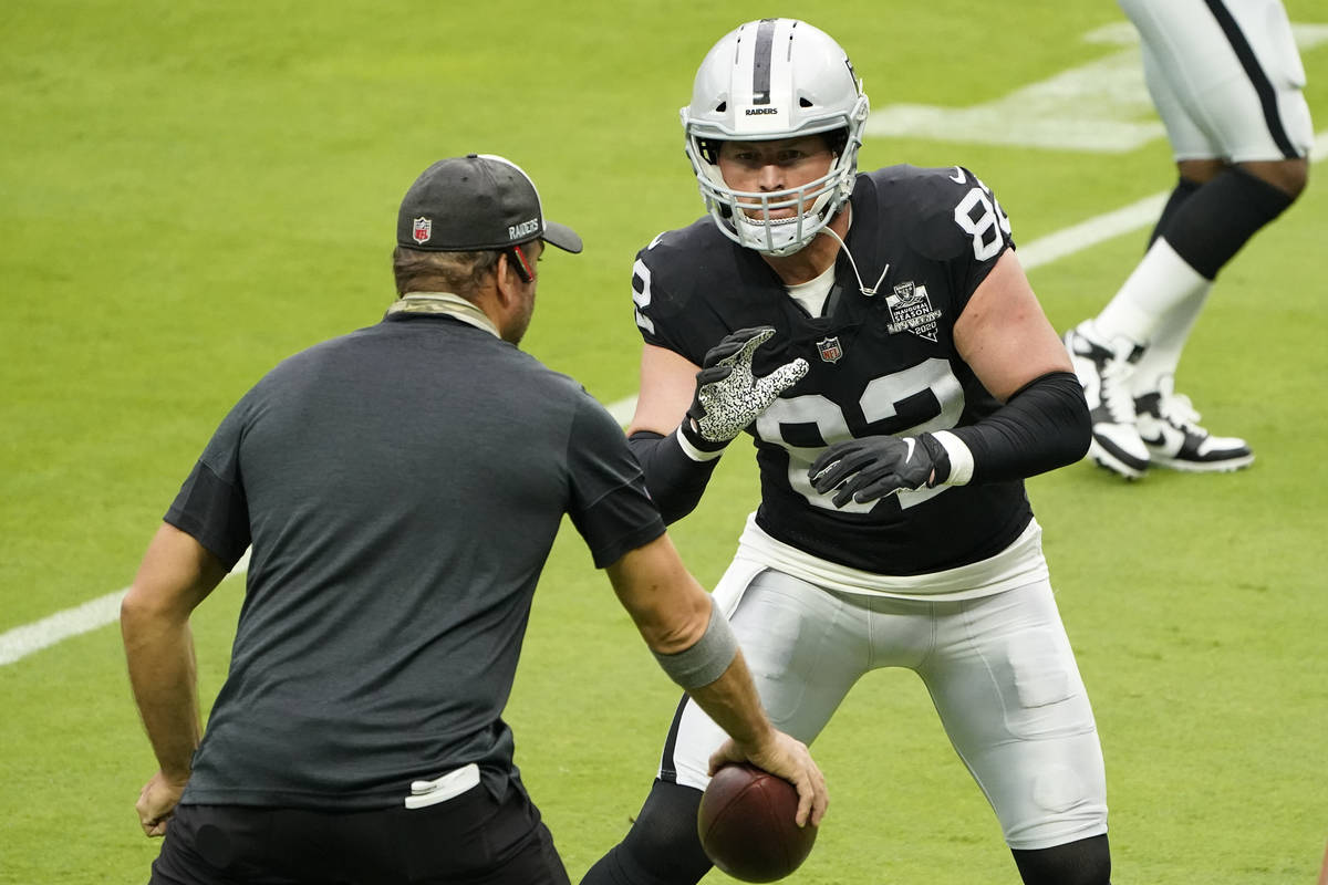 Las Vegas Raiders tight end Jason Witten (82) runs a drill during an NFL football training camp ...