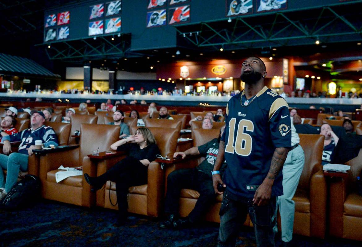 People watch Super Bowl LIII at the Westgate Superbook in Las Vegas in Las Vegas, Sunday, Feb. ...