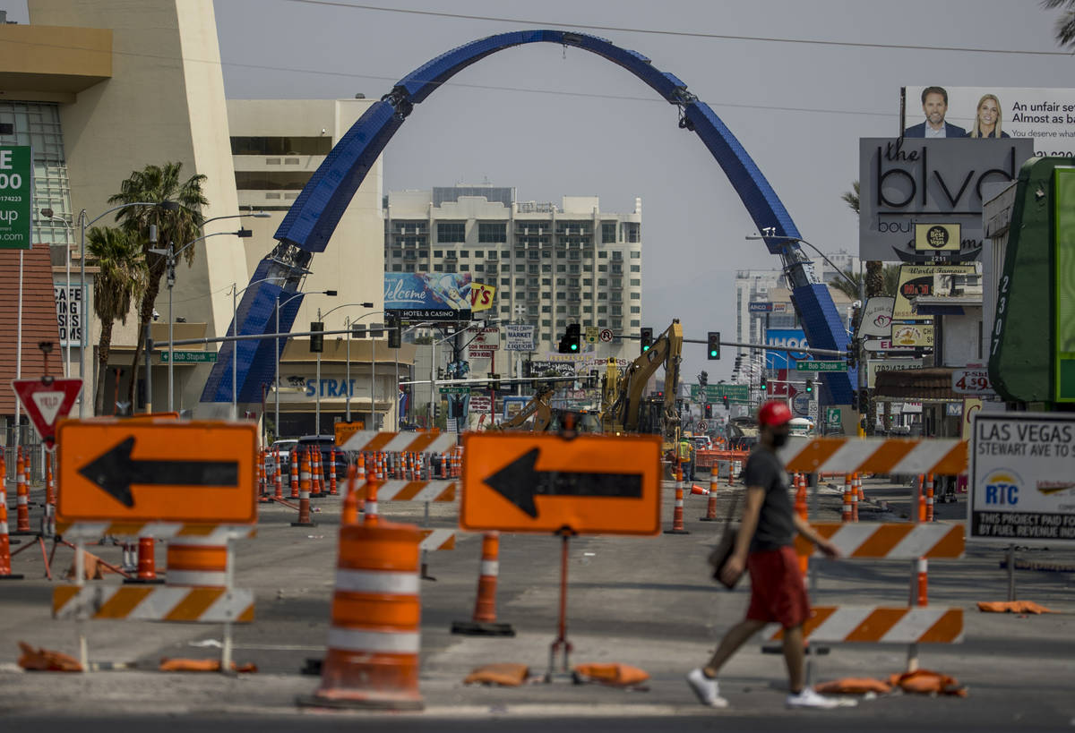 The street is in transition as construction continues of the 80-foot-tall gateway arch over Las ...