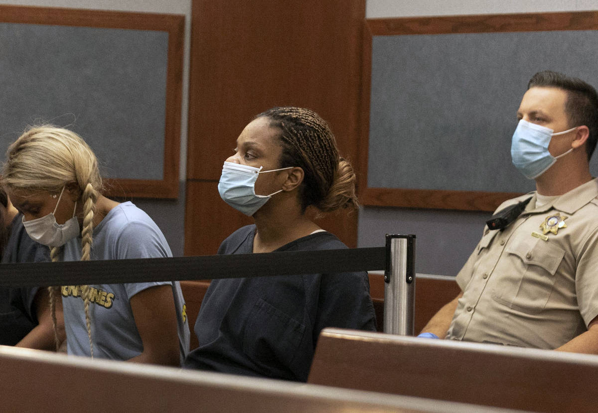 Ebone Whitaker, center, charged with DUI in a crash that left two teens dead, appears in court ...