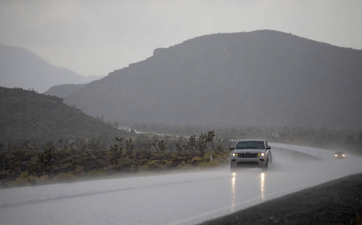 Motorists leave Mount Charleston as rain pours on Saturday, Aug. 22, 2020, at Spring Mountains ...