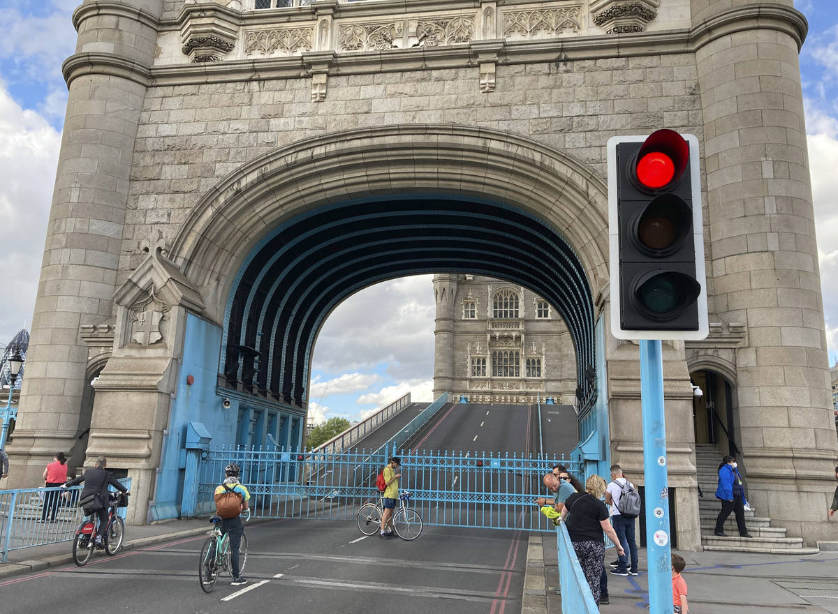 Tower Bridge crossing the River Thames is stuck open, leaving traffic in chaos and onlookers st ...