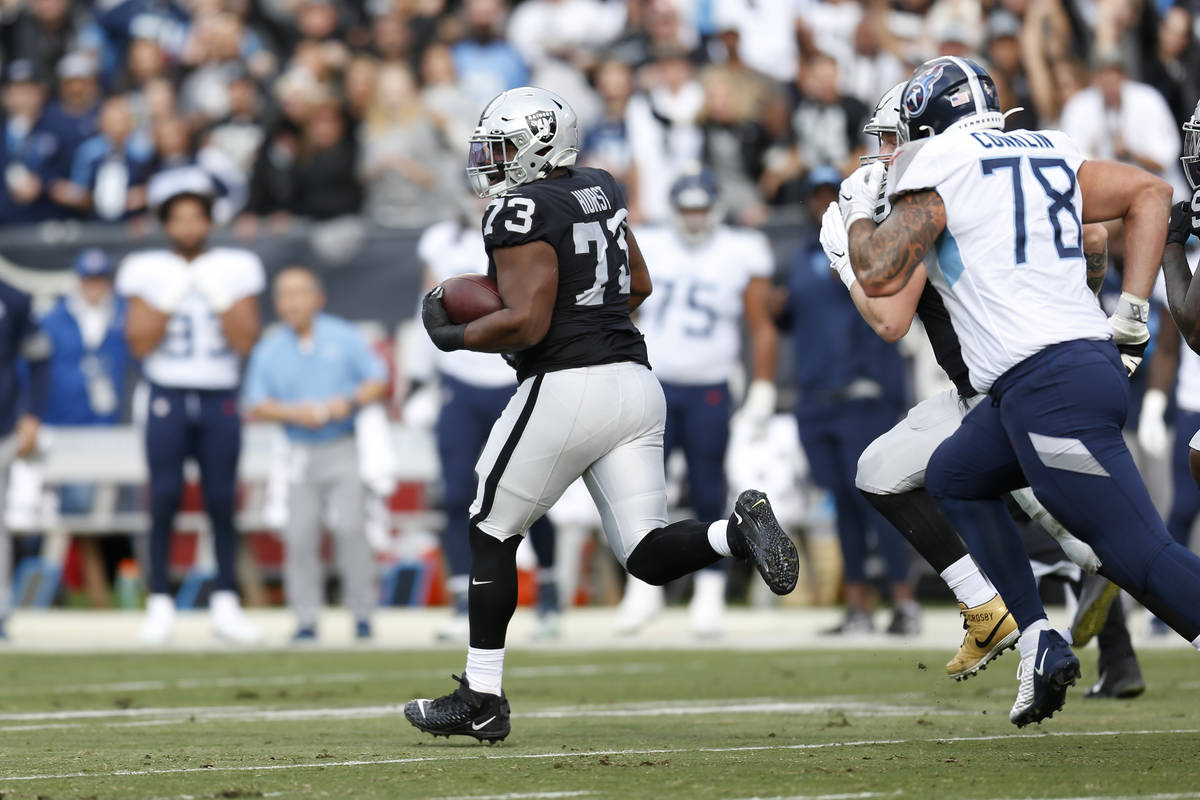 Oakland Raiders defensive tackle Maurice Hurst (73) runs after intercepting a pass against the ...